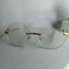 Cartier Frameless Round Glasses with Gold Panther Embellishment