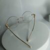 Cartier Frameless Round Glasses with Gold Panther Embellishment