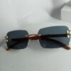 Cartier Luxury Rimless Wooden Temple Sunglasses with Gold Accents