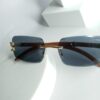 Cartier Luxury Rimless Wooden Temple Sunglasses with Gold Accents
