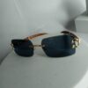 Cartier Luxury Rimless Wooden Temple Sunglasses with Gold Accents