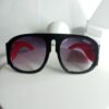 Gucci Black Frame Red Arm Shield Sunglasses with Purple Gradient Lenses