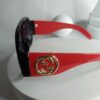 Gucci Black Frame Red Arm Shield Sunglasses with Purple Gradient Lenses