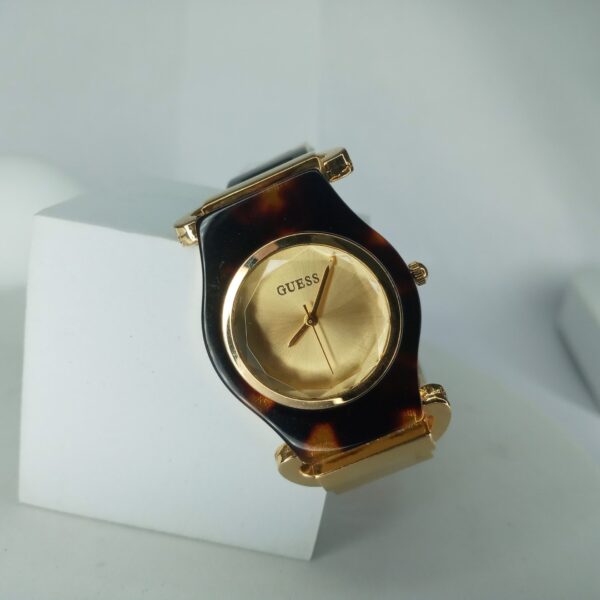 Guess Women's Gold Tone Faceted Crystal Tortoise Shell Analog Watch