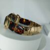 Guess Women's Gold Tone Faceted Crystal Tortoise Shell Analog Watch