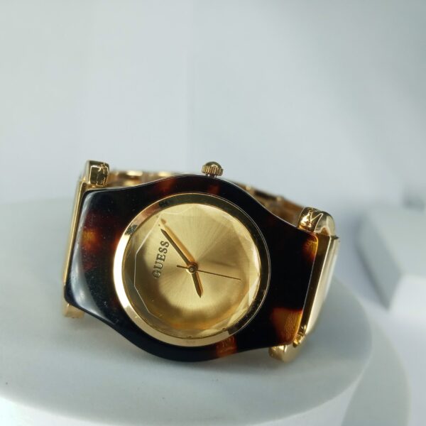 Guess Women's Gold Tone Faceted Crystal Tortoise Shell Analog Watch